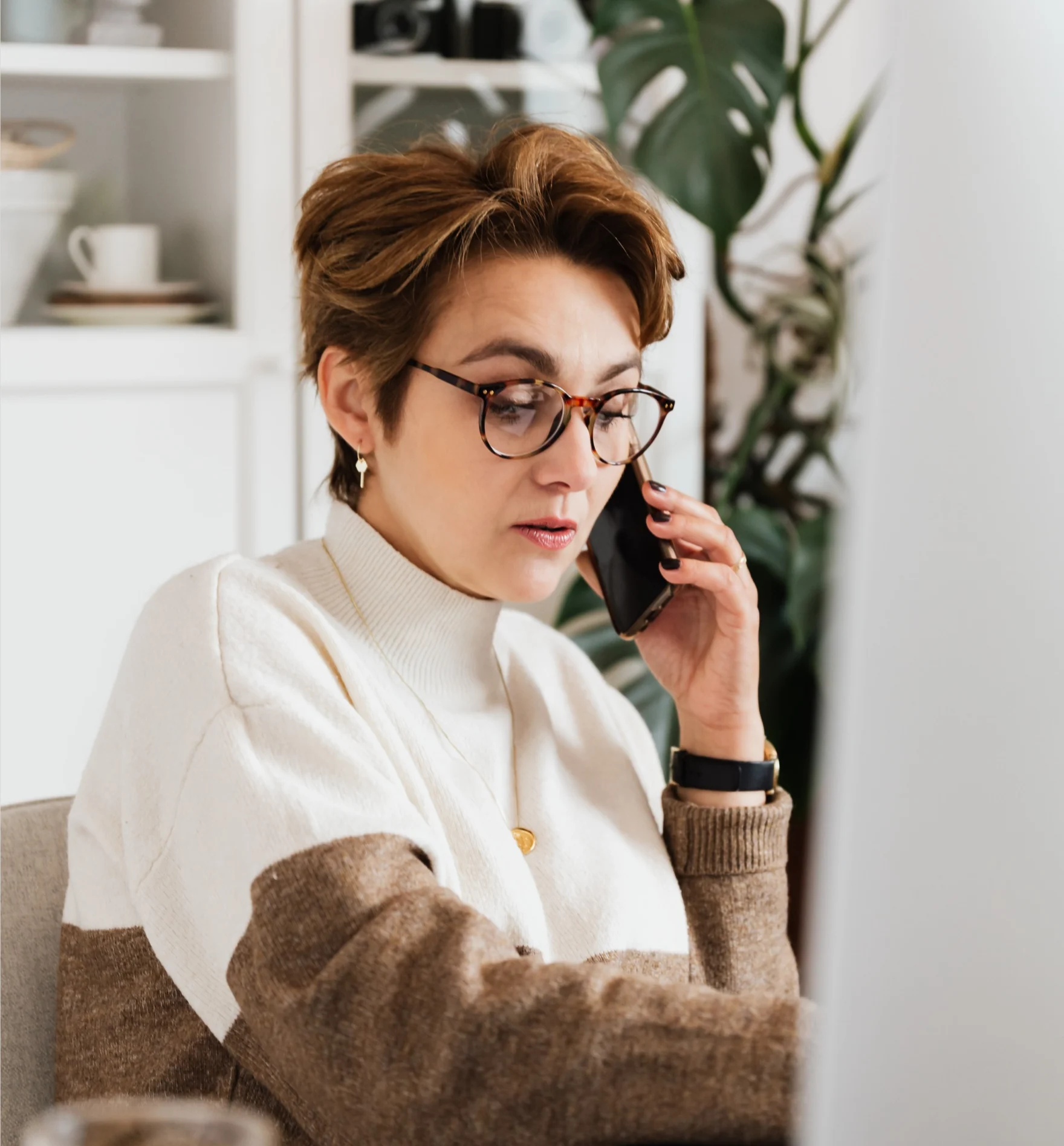 Woman on a phone call working as an executive assistant at a desk