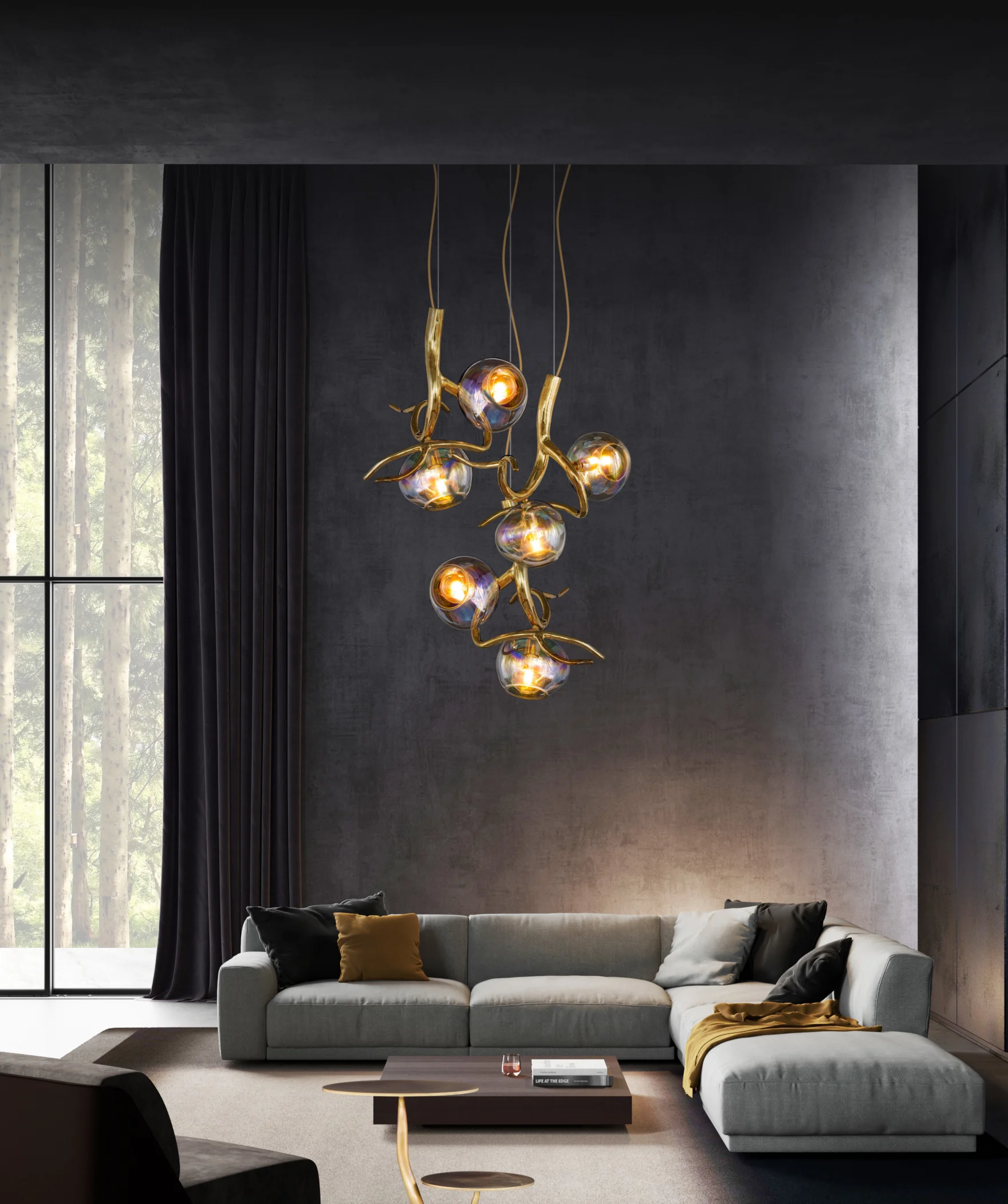 Golden glass bubble chandelier by Brand van Egmond above a grey sofa