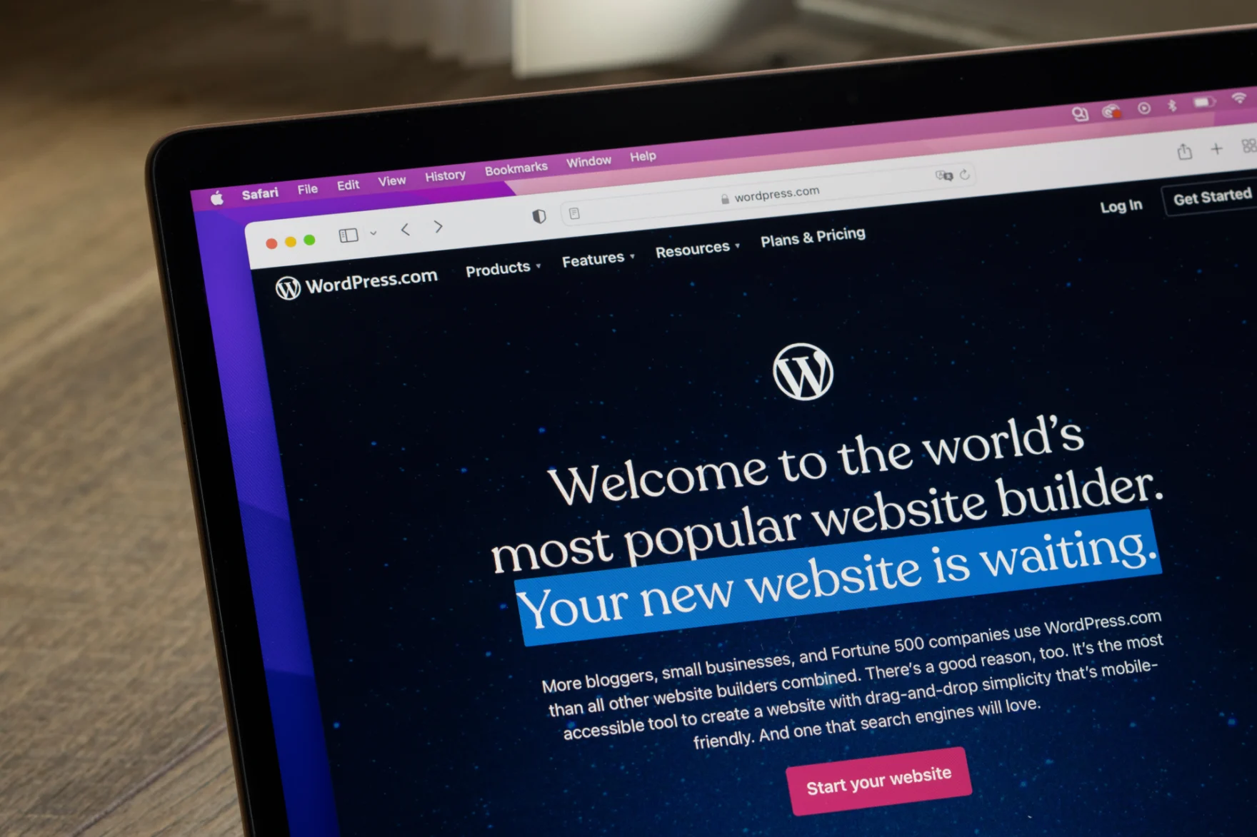 WordPress.com homepage displayed on a laptop screen