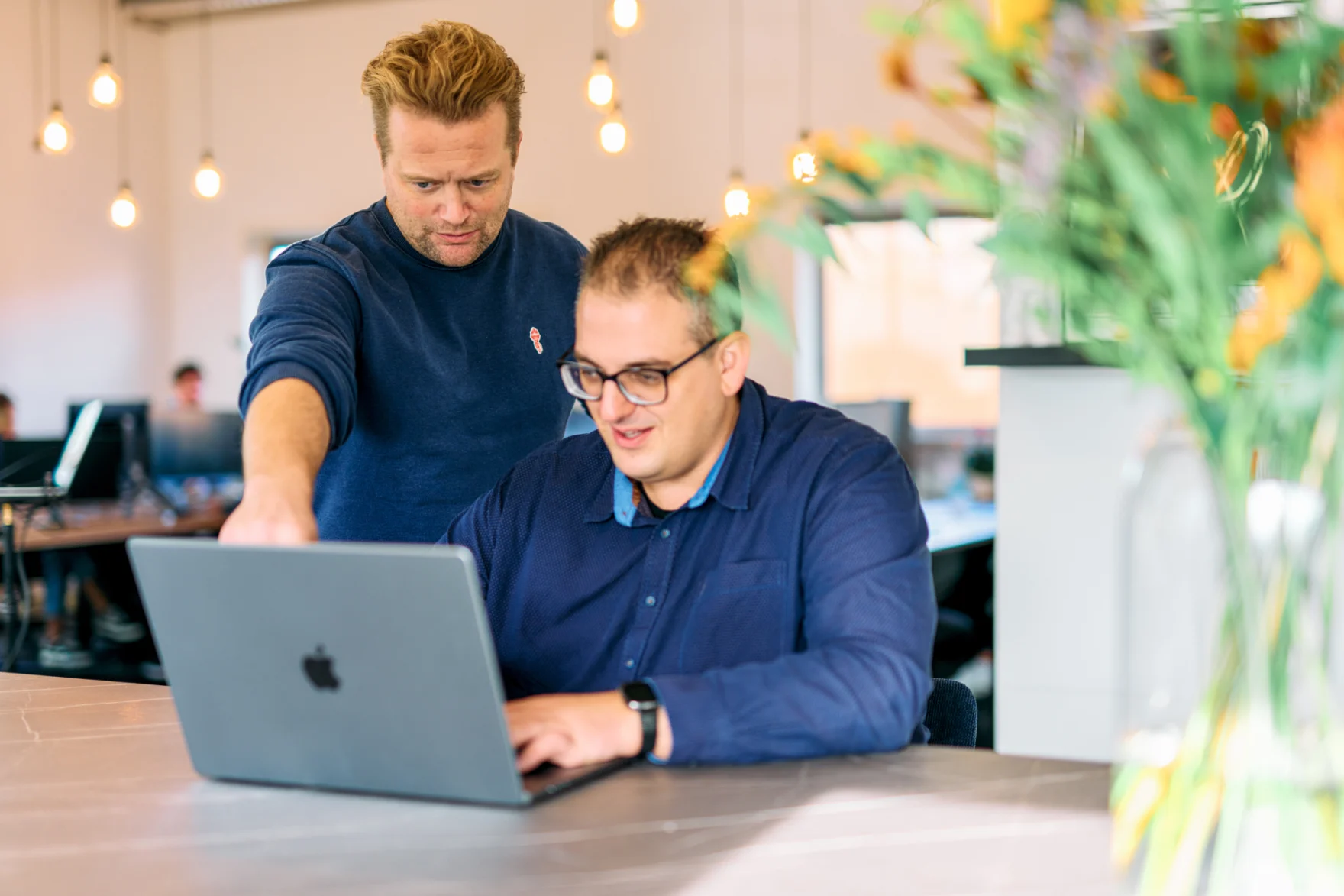 Web development agency Amsterdam — two Marsmedia team members reviewing a build