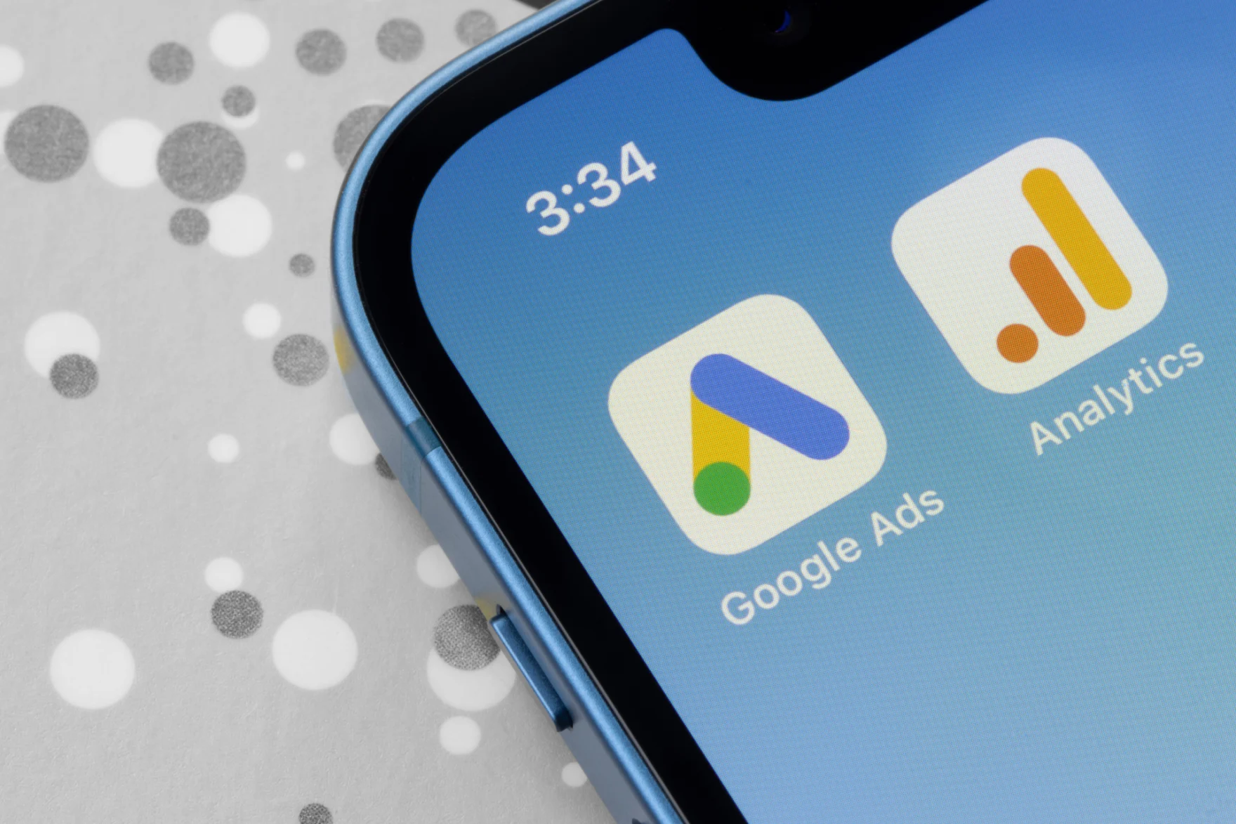 Smartphone screen showing the Google Ads and Google Analytics app icons