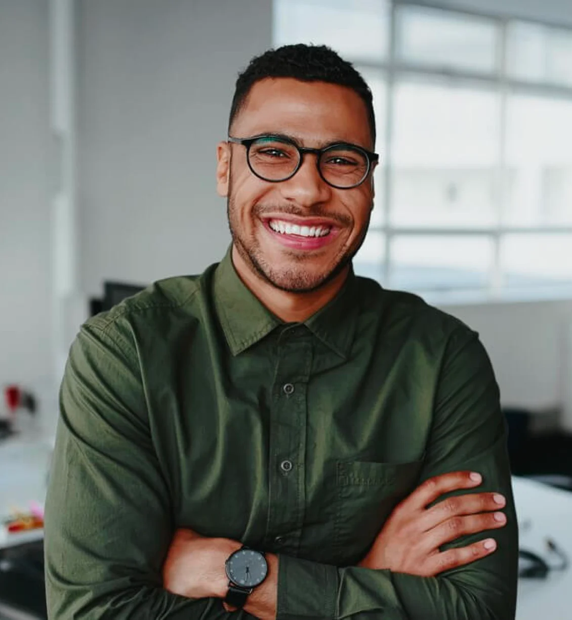 Smiling man in glasses and green shirt, Chiron brand photography example