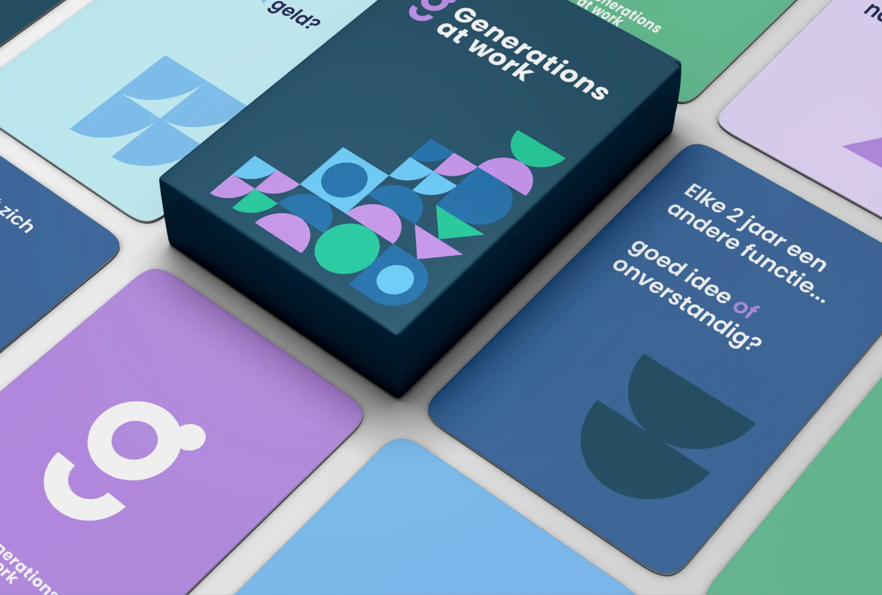 Generations at Work card game box centered among scattered colorful question cards