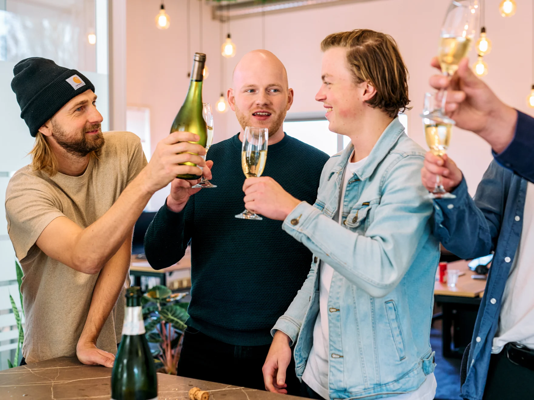 Mars team members toasting with champagne glasses in the office