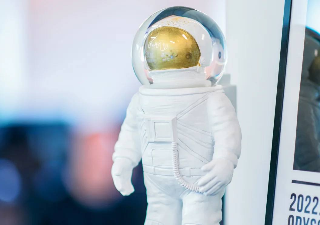 Astronaut figurine displayed on a shelf in the Mars office
