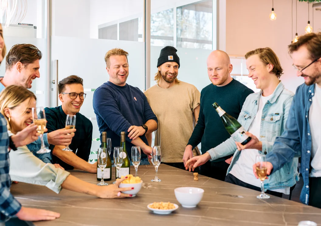 Mars team celebrating together with drinks and snacks in the office