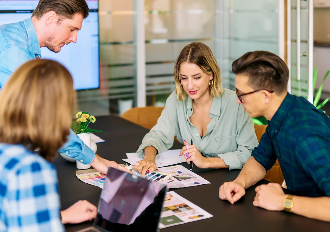 Mars team reviewing color swatches and mood boards in a meeting