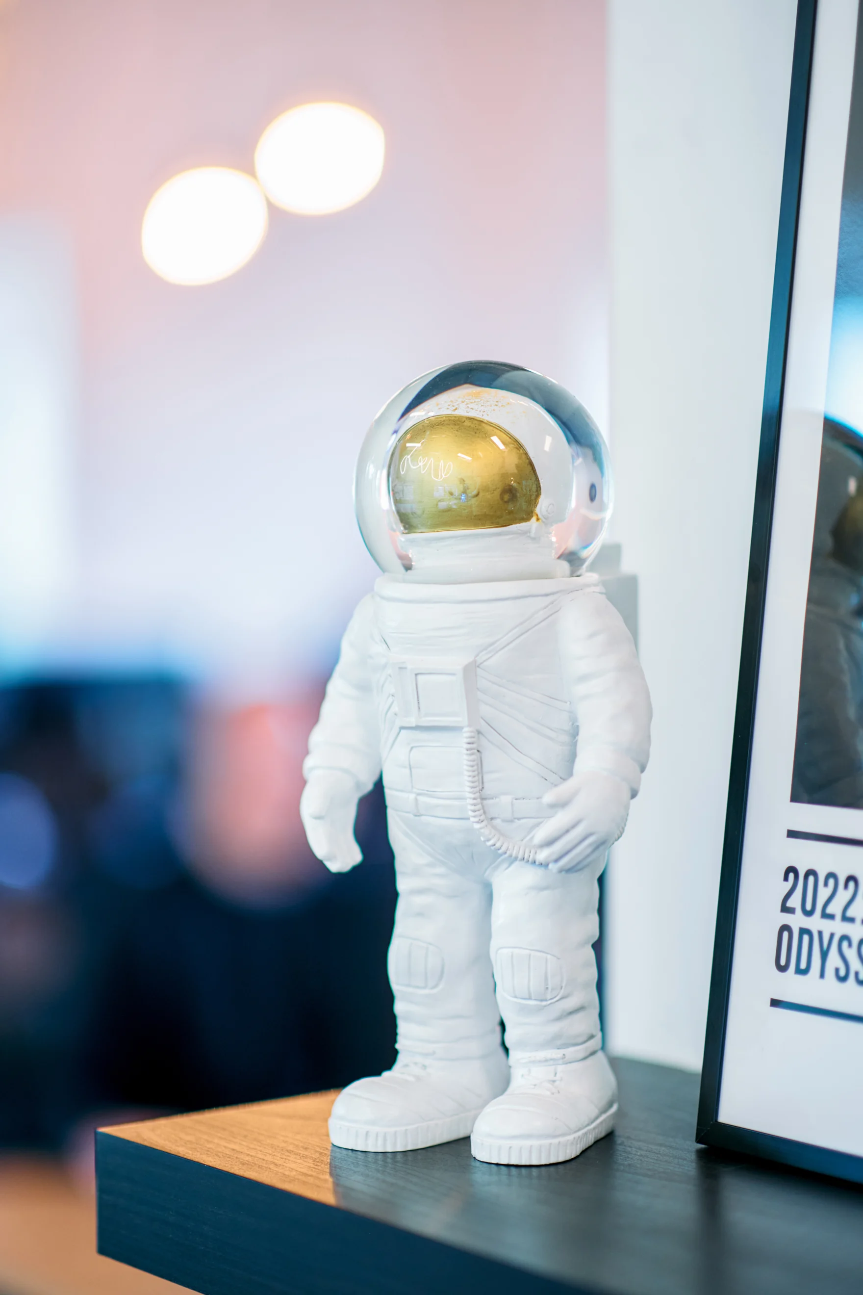 White astronaut figurine on a shelf in the Mars office