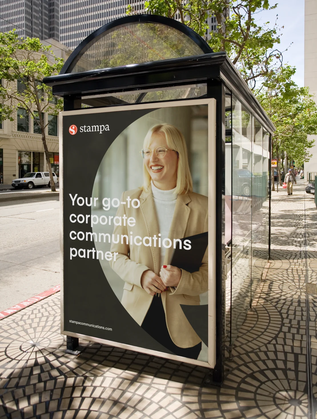 Stampa ad campaign displayed on a city bus shelter poster