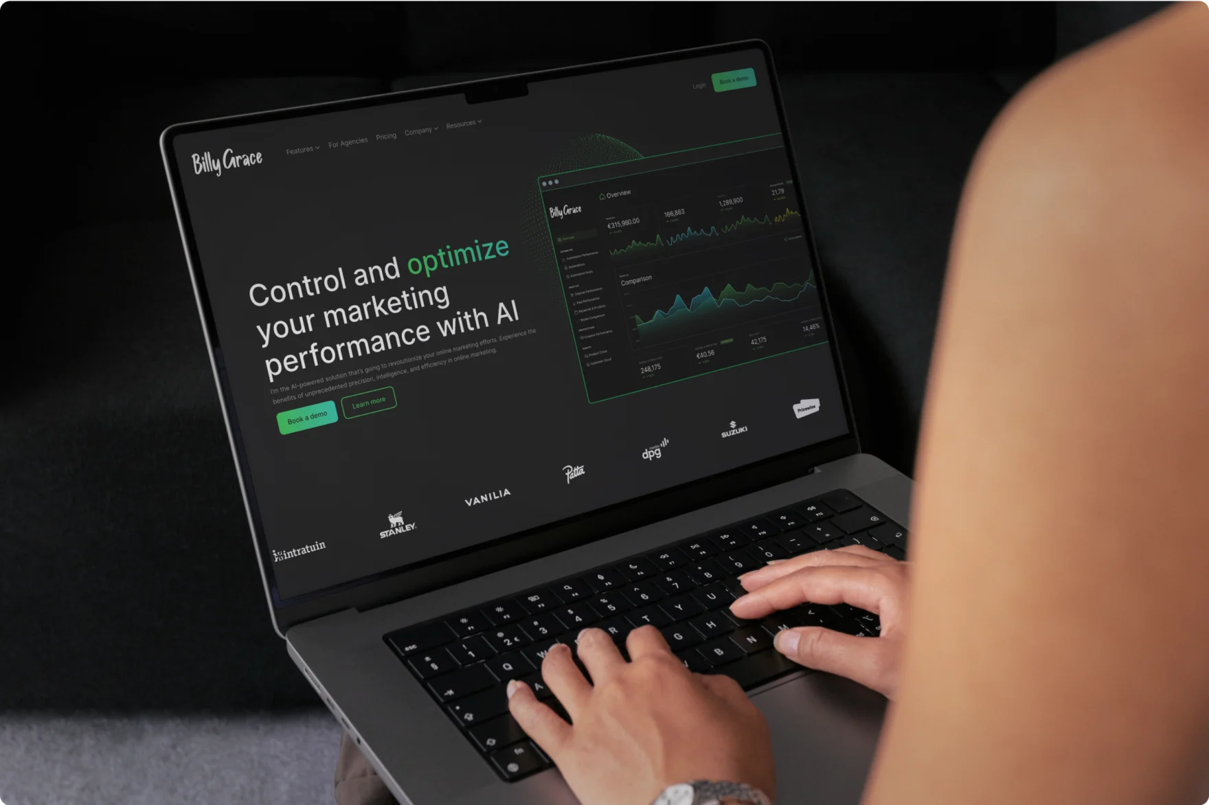 Person typing on a laptop showing the Billy Grace marketing dashboard