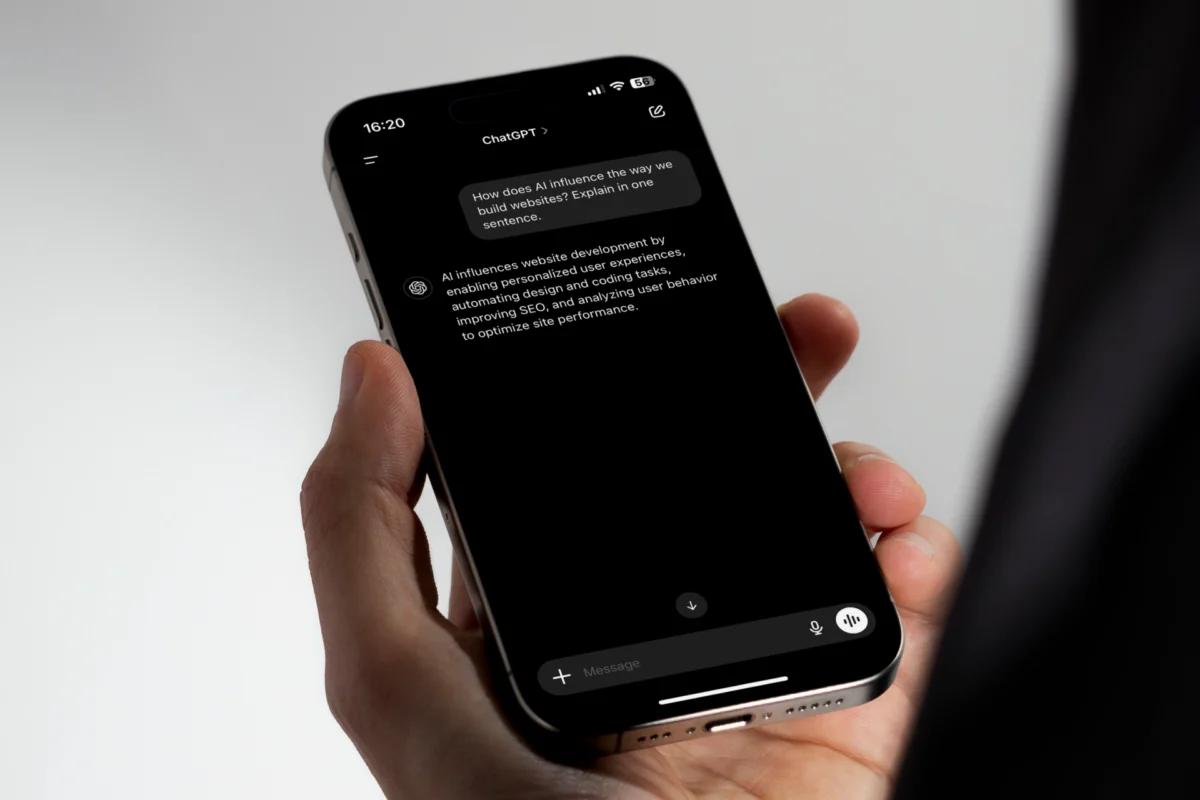 Smartphone screen showing a ChatGPT conversation about AI's influence on website development