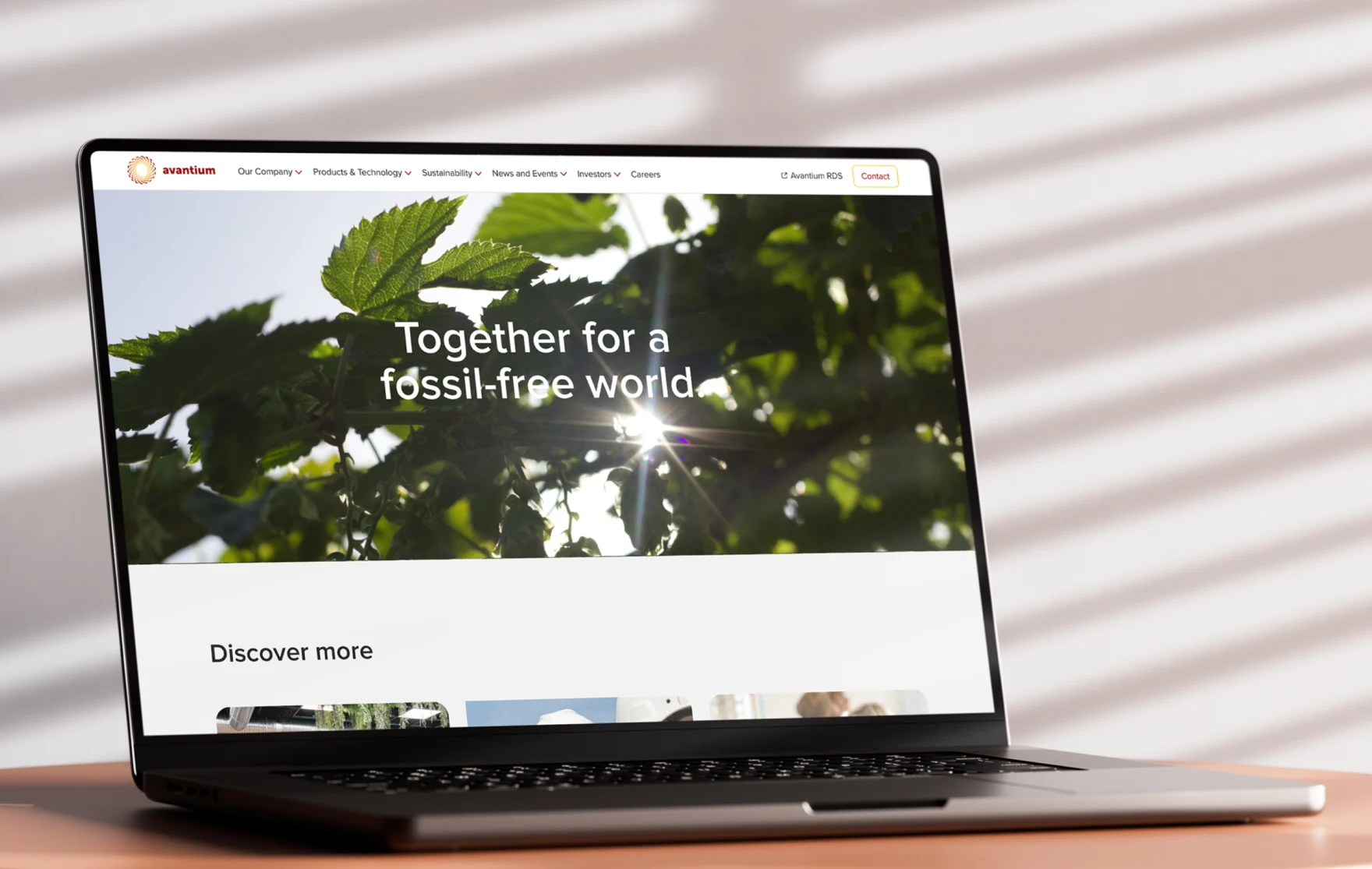 Laptop displaying the Avantium homepage with the together for a fossil-free world headline