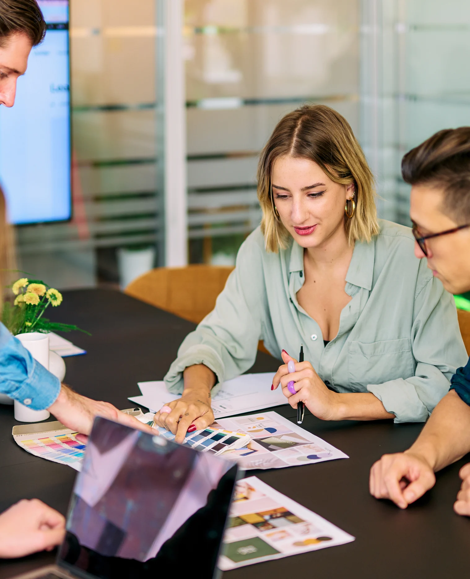Mars team reviewing color swatches and moodboards during a brand strategy session