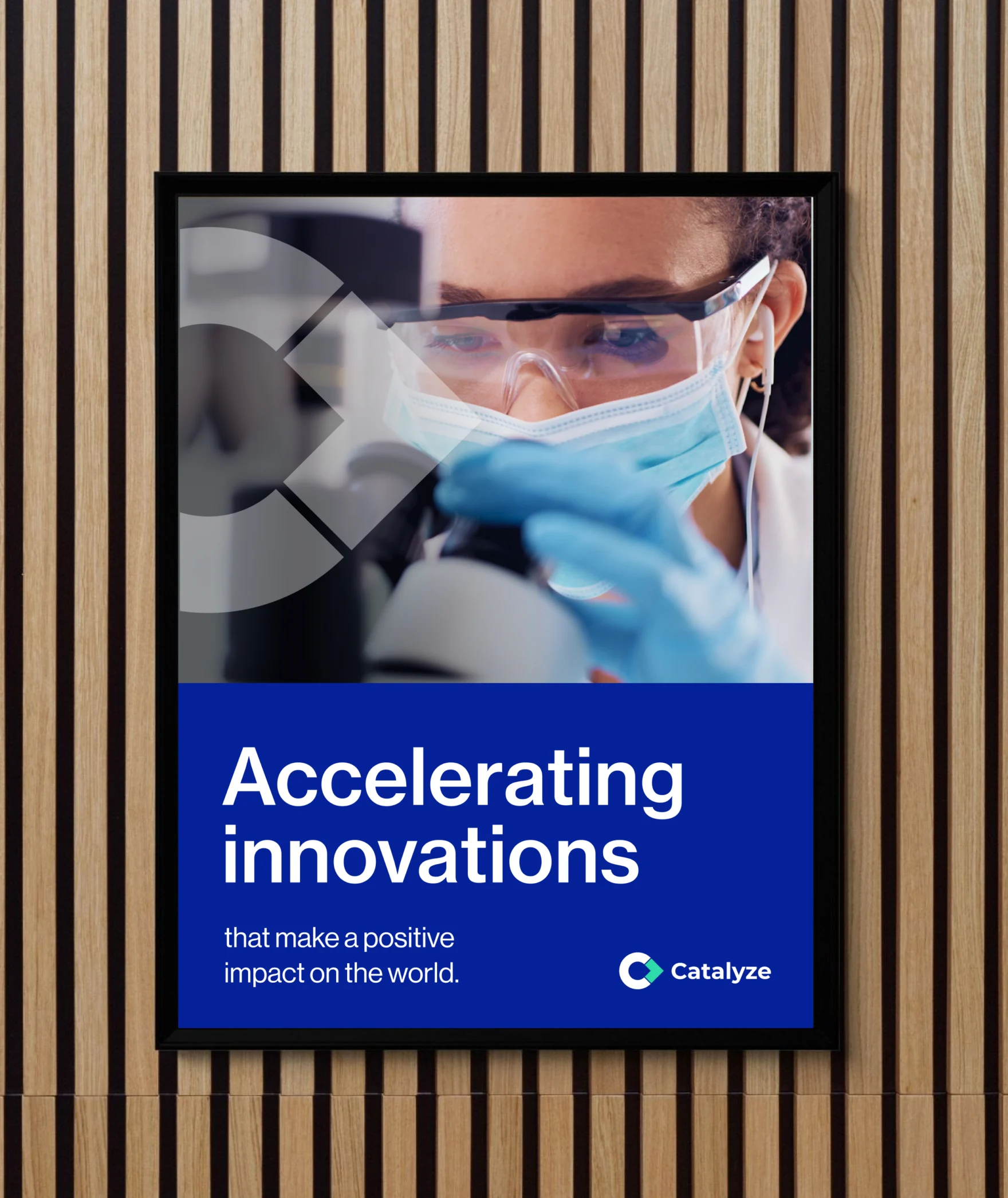Framed poster mockup of the Catalyze brand tagline 'Accelerating innovations that make a positive impact'