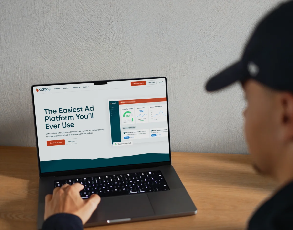 Homepage of the Adgoji website designed by Mars, displayed on a laptop
