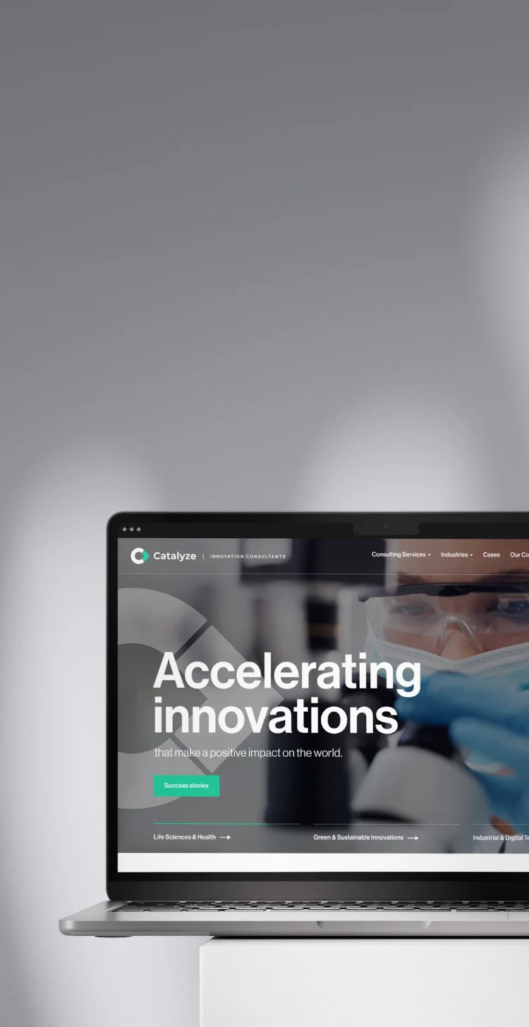 Catalyze homepage displayed on a laptop screen against a blurred background