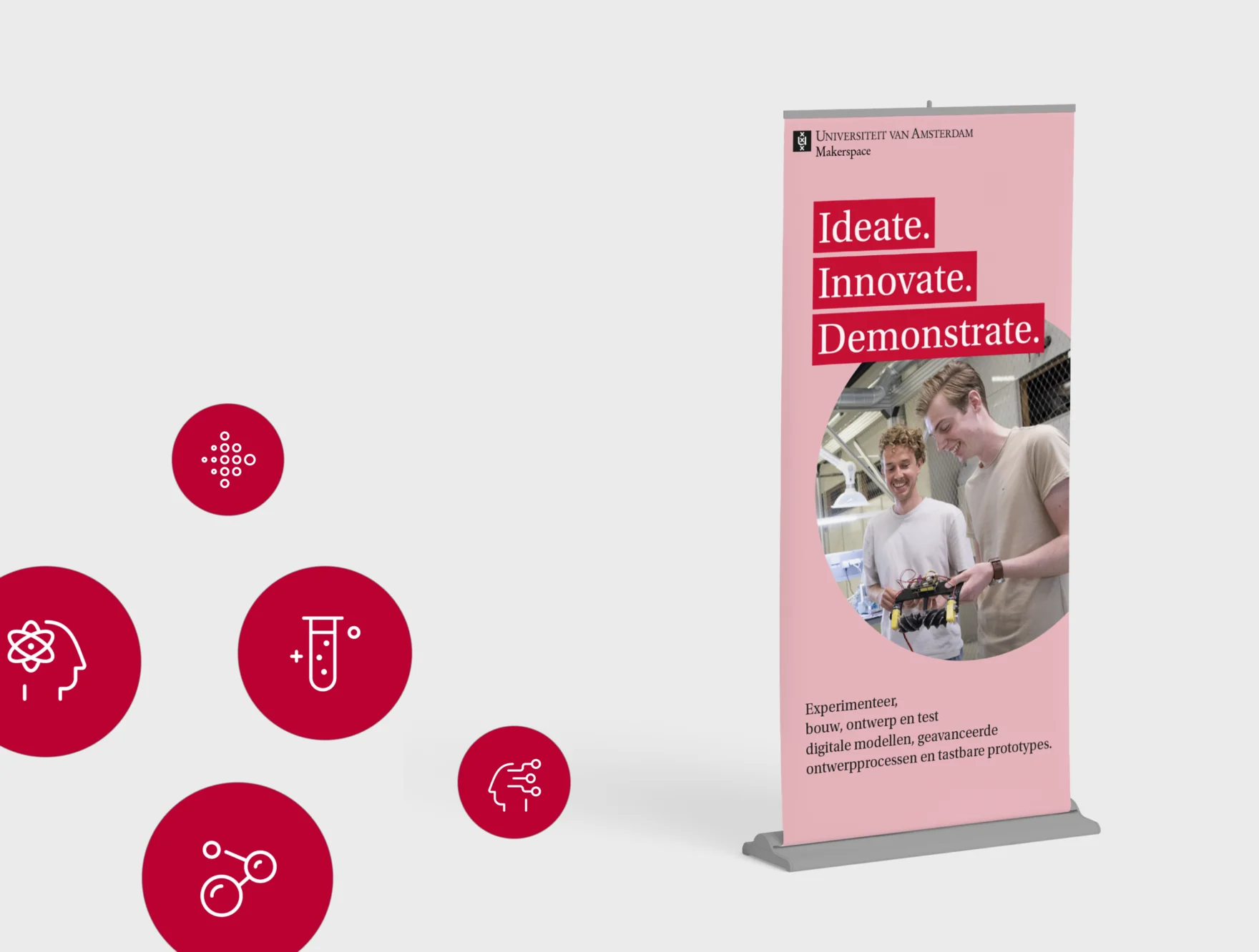 Roll-up banner mockup of the University of Amsterdam Makerspace design showing students prototyping electronics