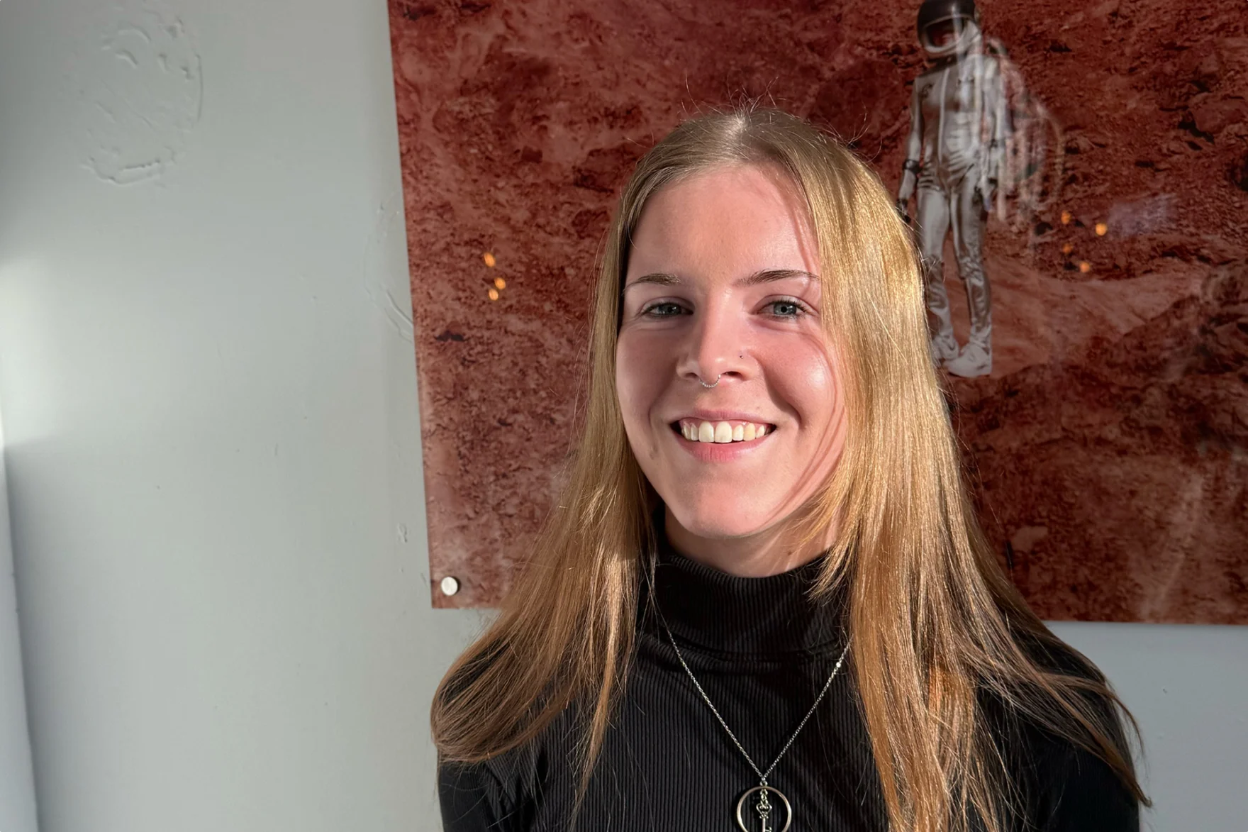 Romy Jongkees, Mars' new junior developer, smiling in the office