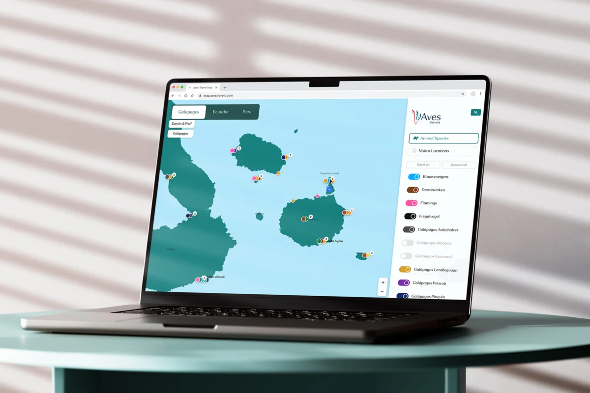 Laptop displaying the interactive Aves Travels wildlife sighting map