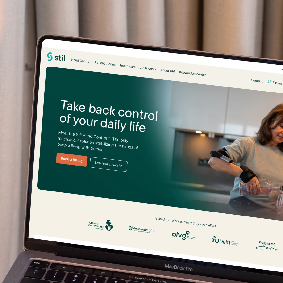 Homepage of the Stil website displayed on a MacBook Pro laptop screen.