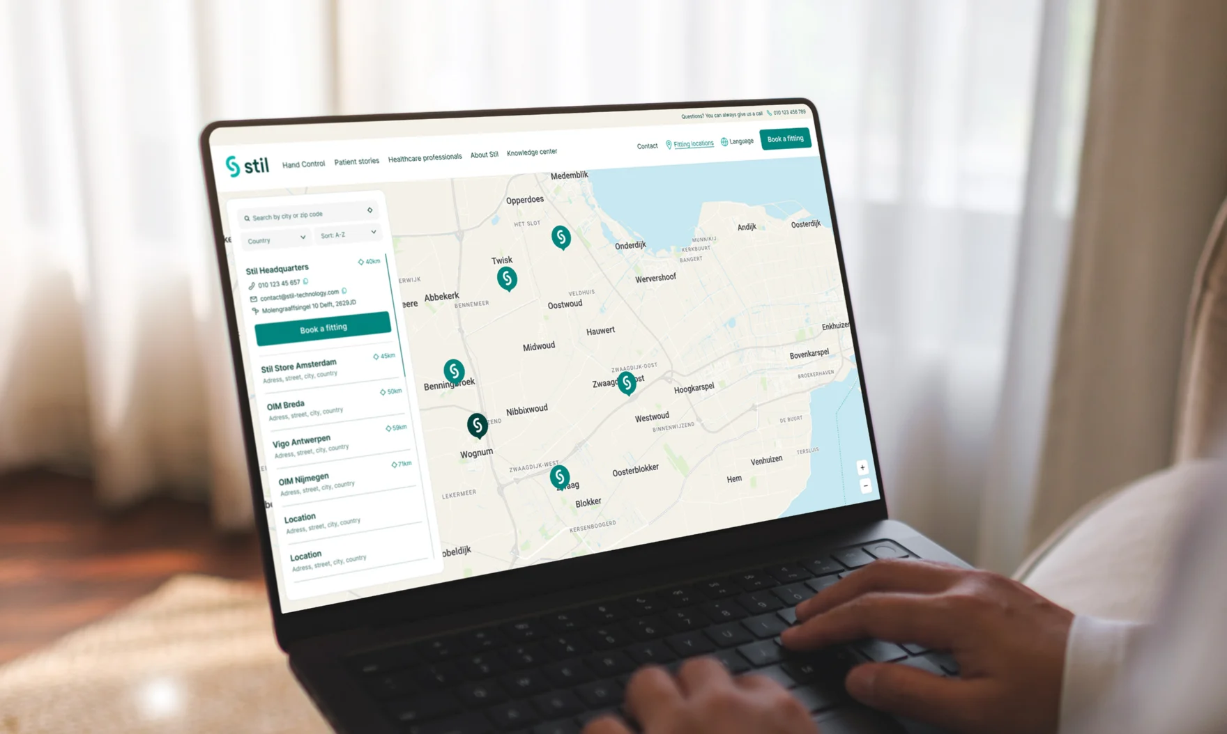 Laptop displaying the interactive fitting locations map on the Stil website